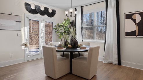 Butner Estates community model home breakfast area off of the kitchen and living room with access to the back yard