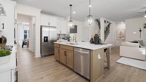 Kitchen with island and stainless steel appliances.