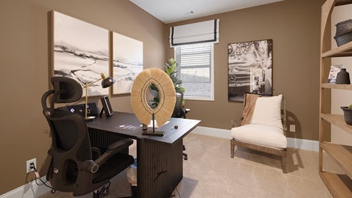 Bedroom space with carpeted floors and a window.
