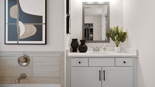 Primary bathroom with white appliances.