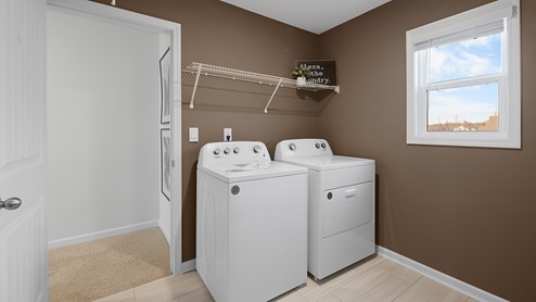Laundry room with built in storage.