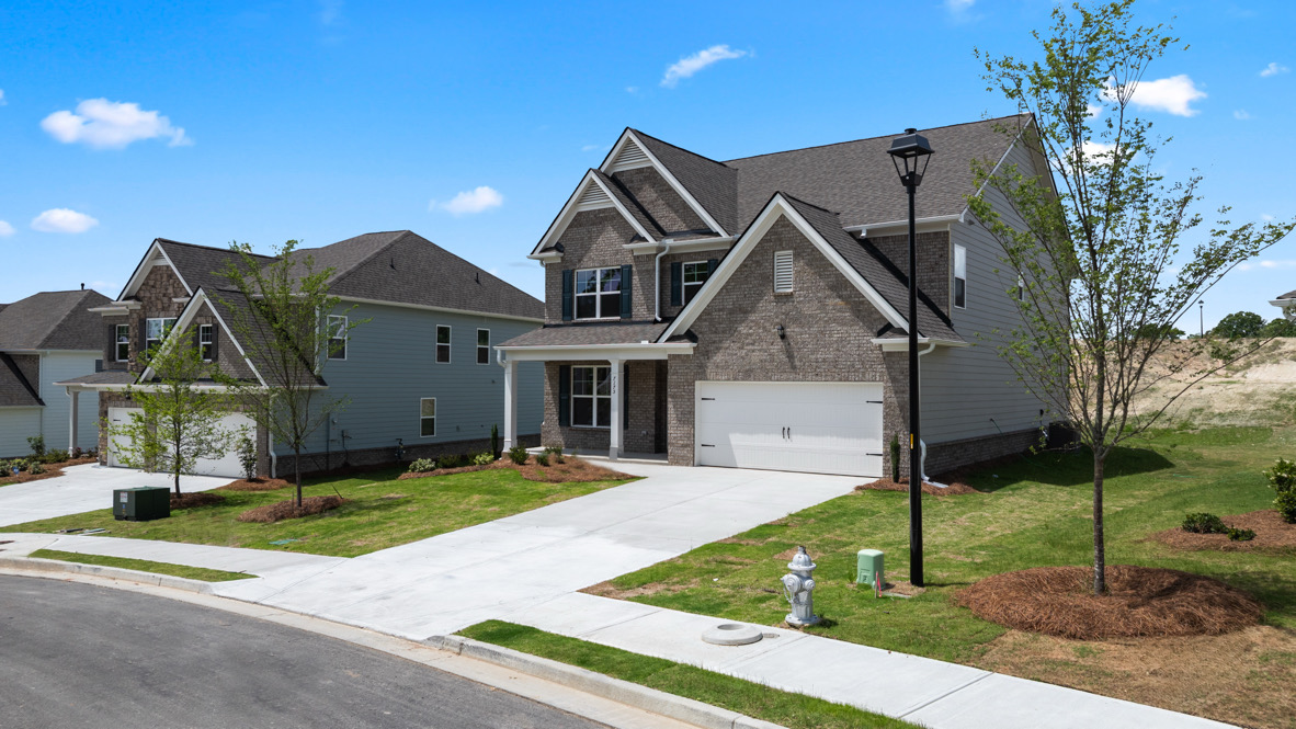 Exterior of the Bellview Plan by D.R. Horton in Butner Estates South Fulton, GA showcasing New Construction Home with modern curb appeal