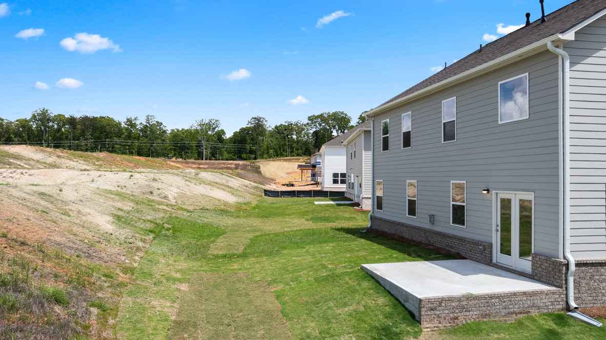 Exterior of the Bellview Plan by D.R. Horton in Butner Estates South Fulton, GA showcasing New Construction Home with modern curb appeal