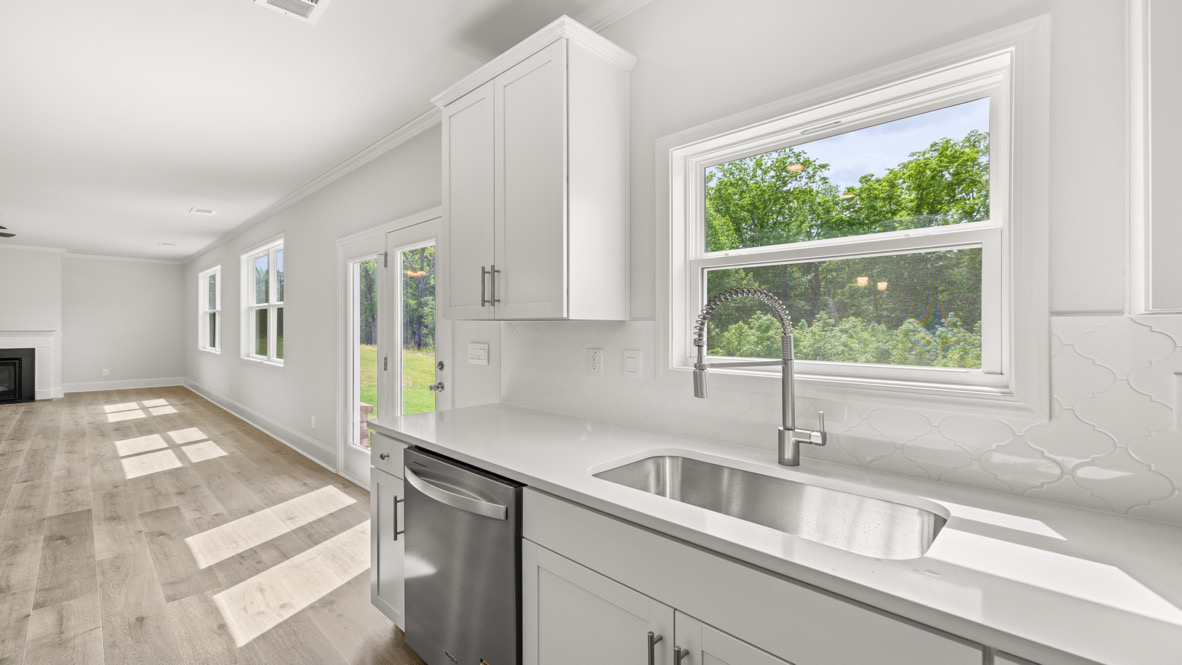 Interior kitchen with sink and large windows
