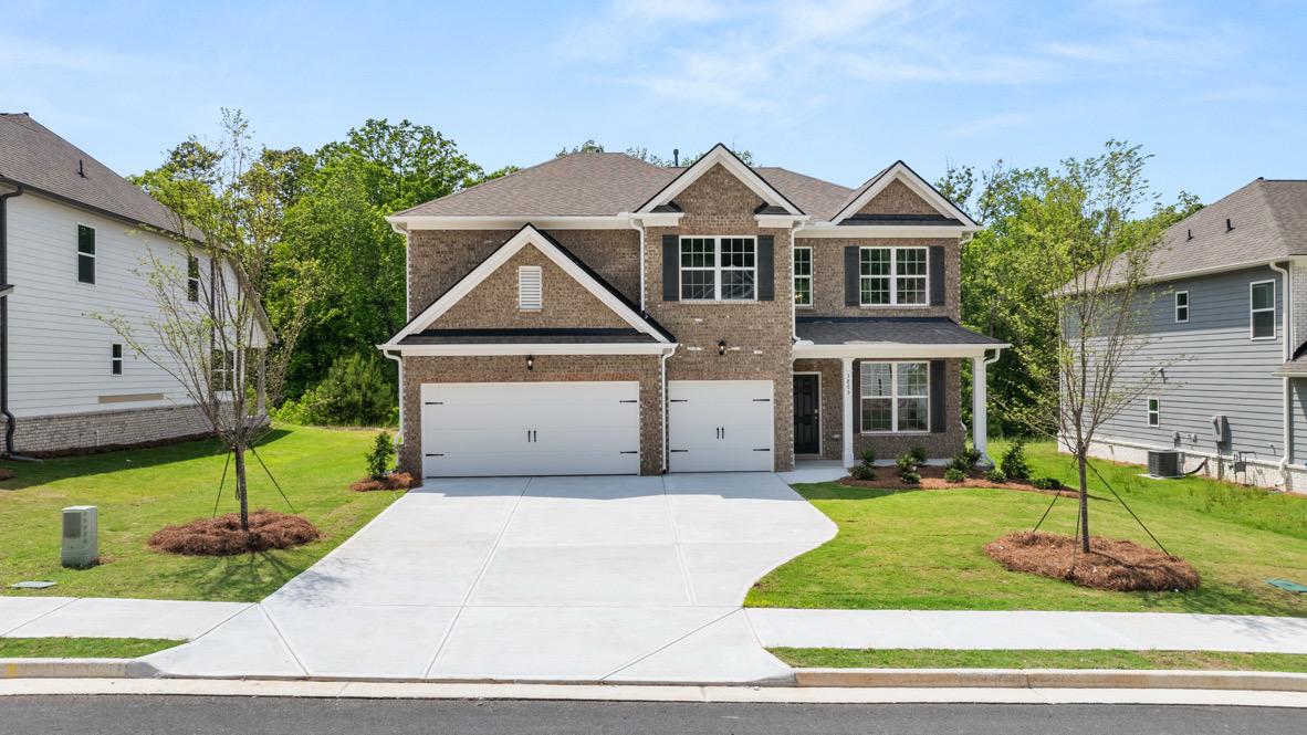Exterior two-story home with stone detailing
