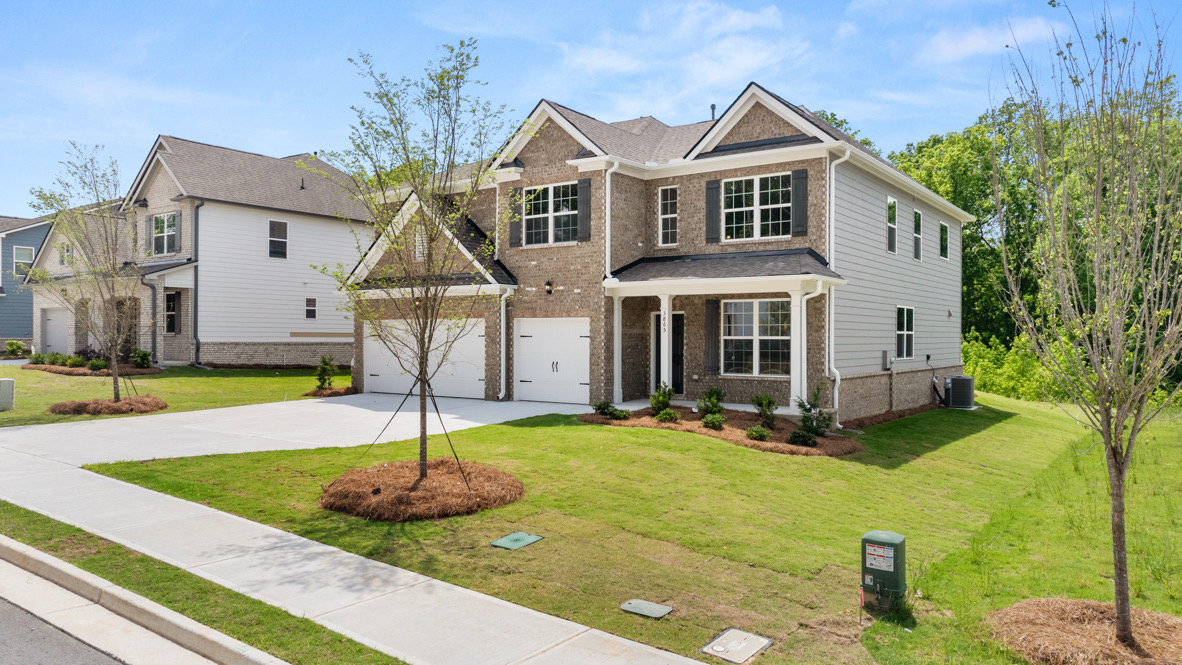 Exterior two-story home with stone detailing