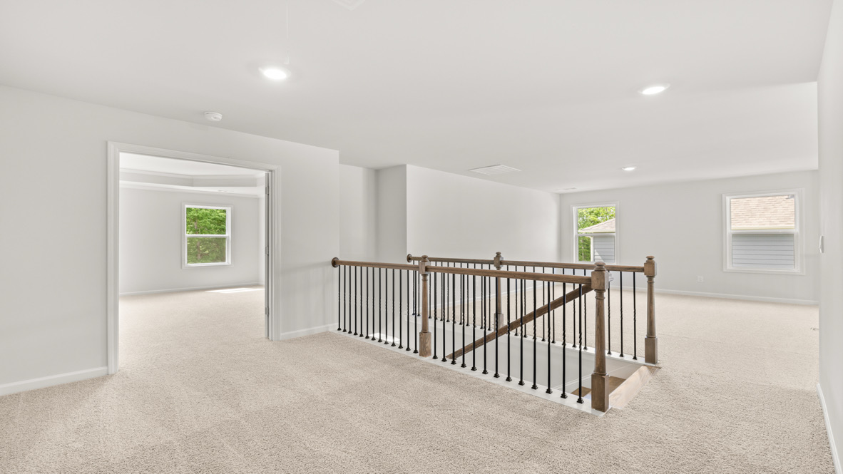 Interior upstairs living area open to staircase