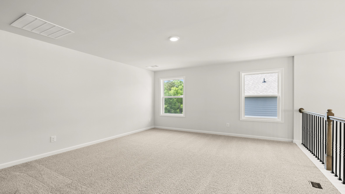 Interior upstairs living area open to staircase