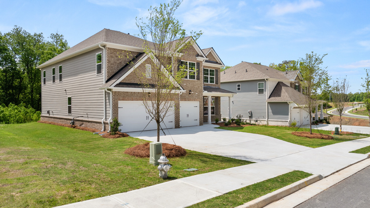 Exterior two-story home with stone detailing