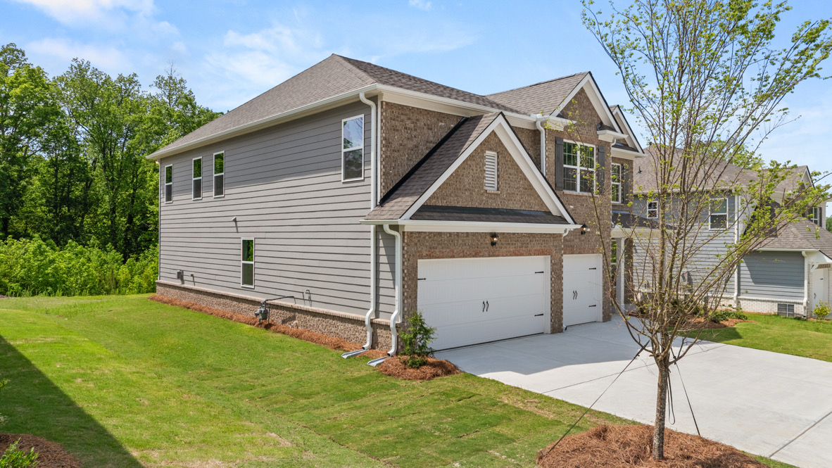 Exterior two-story home with stone detailing