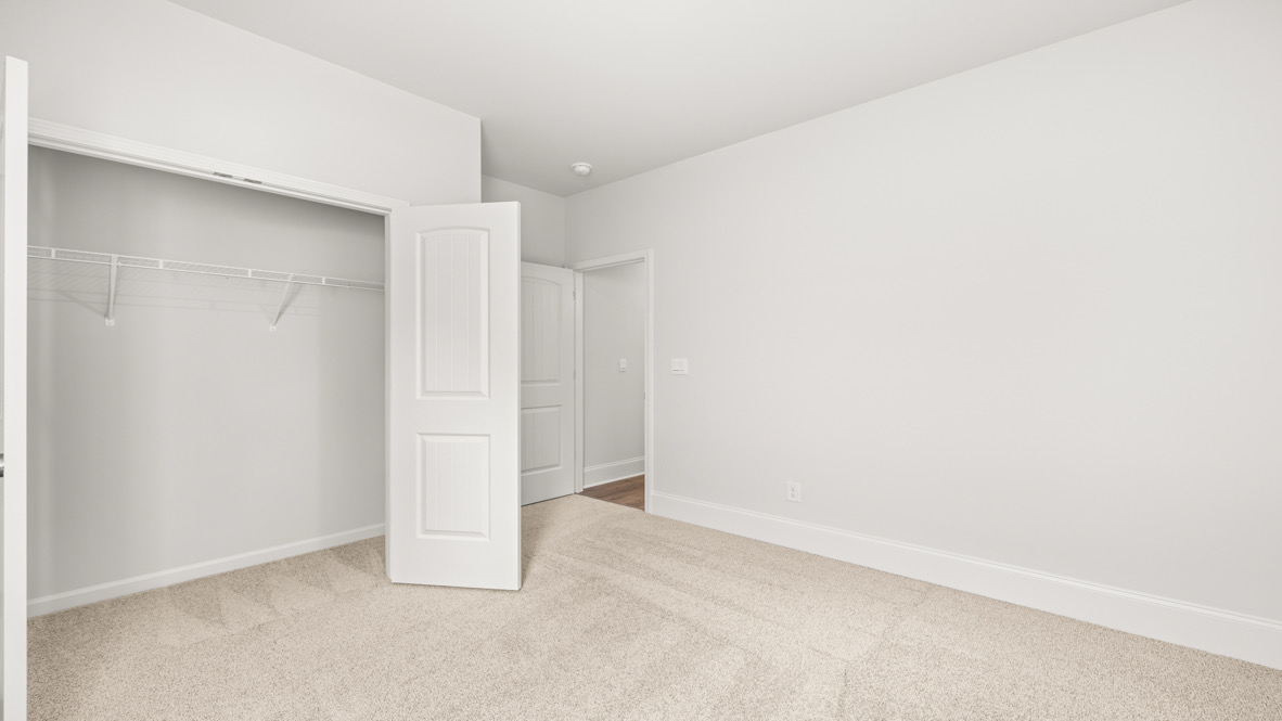 Overhead storage and laundry layout in Butner Estates crafted by D.R. Horton for efficient use