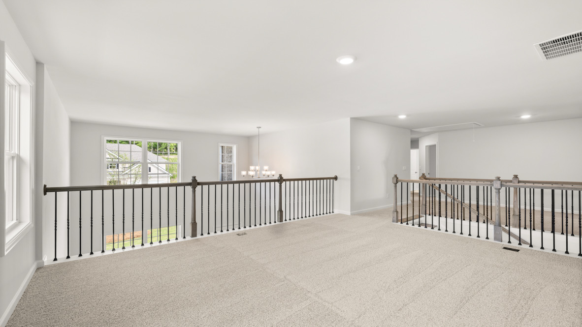 Loft + Secondary Bedroom Open layout upstairs features loft flowing into secondary bedroom, ideal for multipurpose use