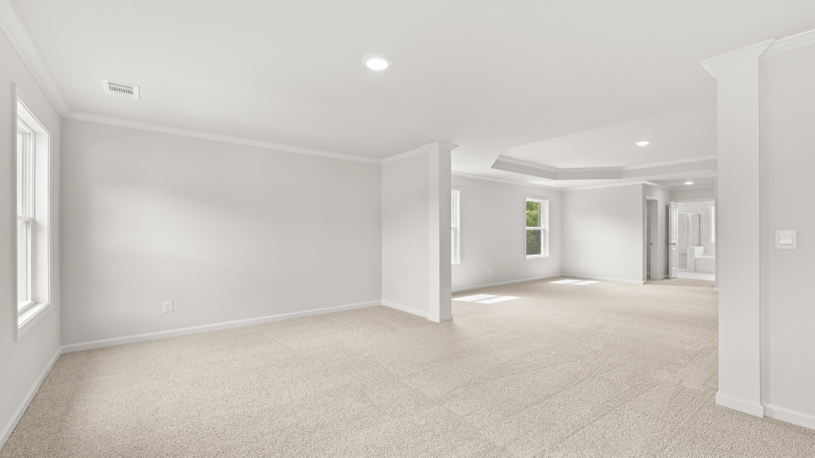 Secondary Bedroom New Home bedroom features traditional closet doors, carpeted floors, and spacious wall arrangement for flexible room design