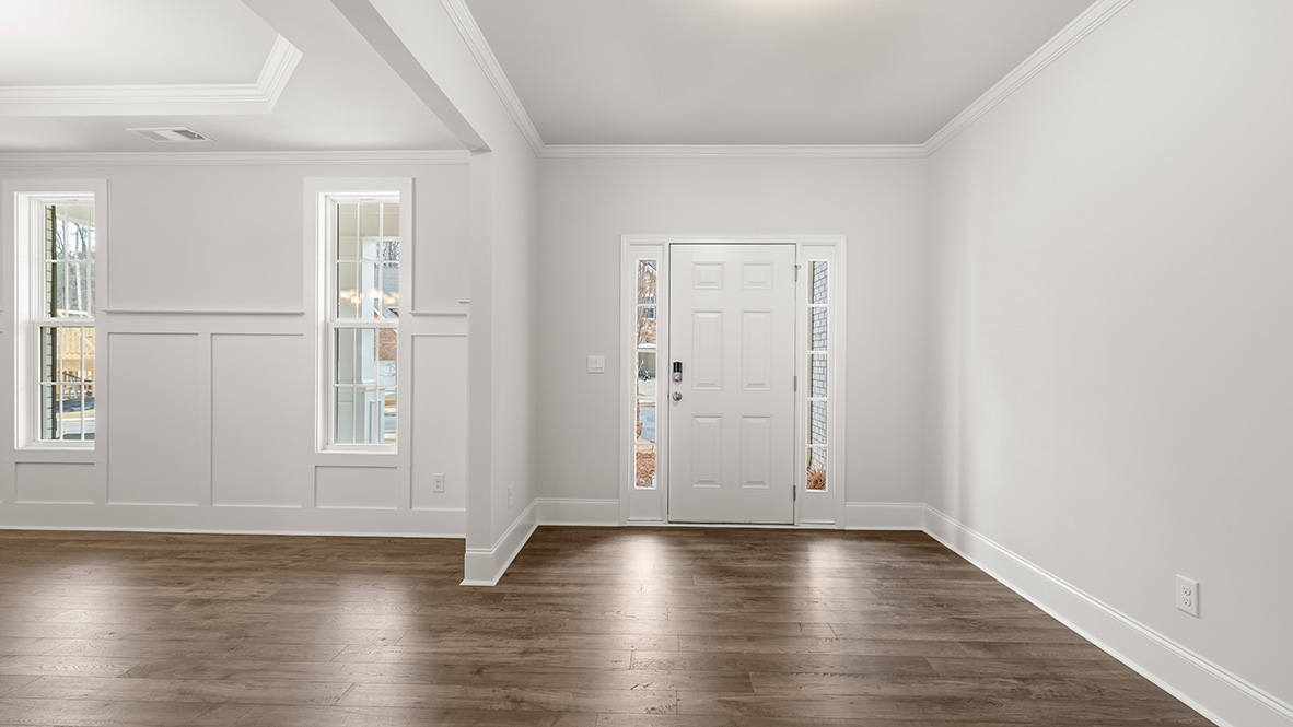 Interior entry-way next to flex room with large windows