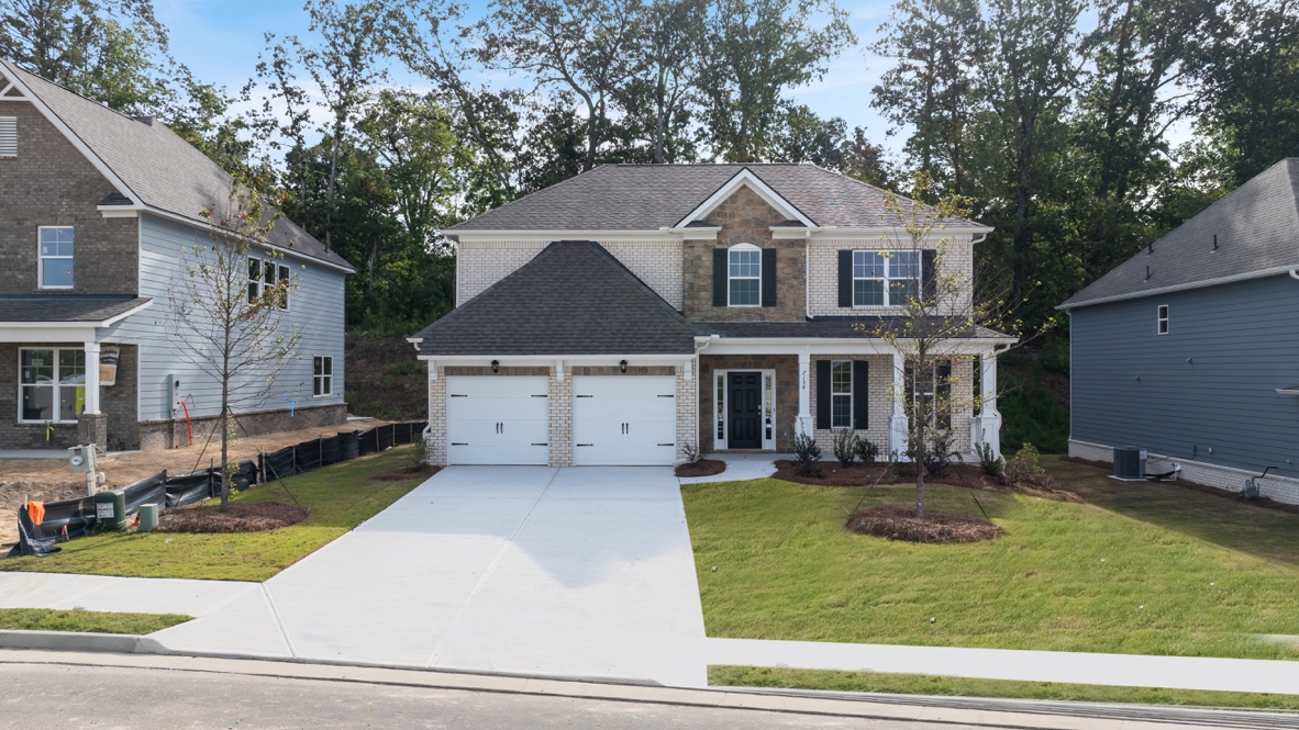 Exterior two-story home with stone detailing
