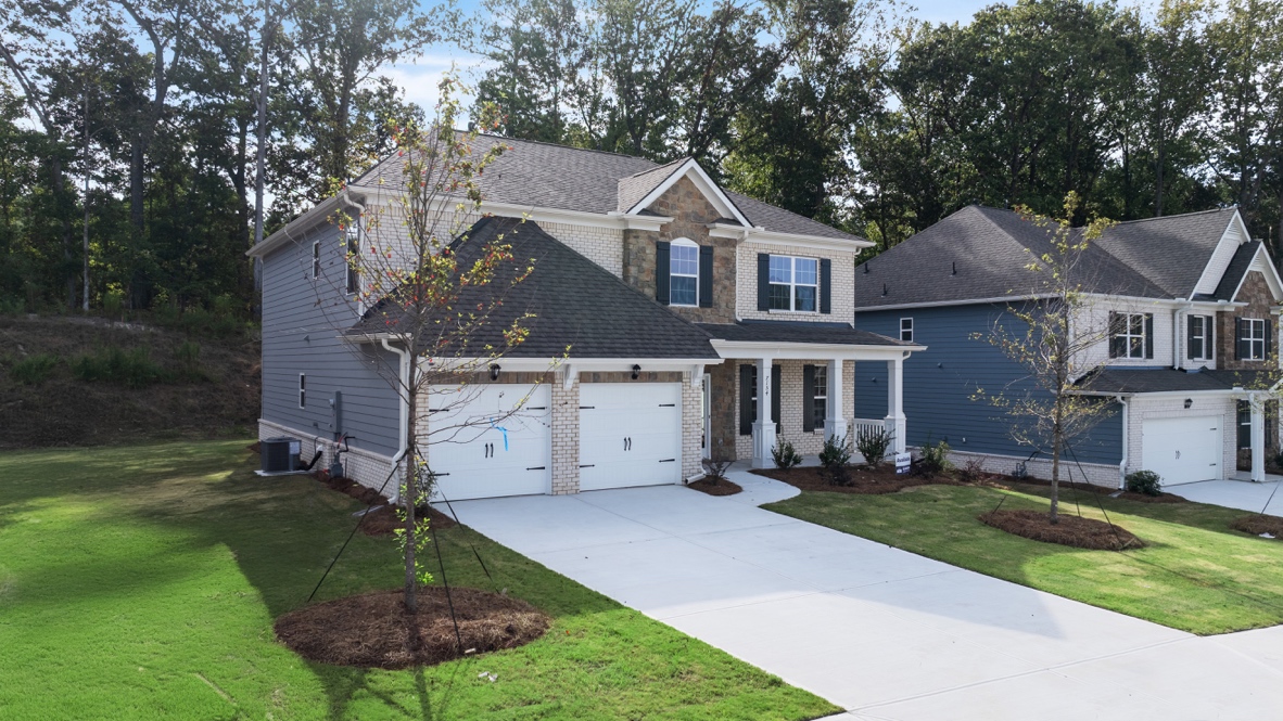 Exterior two-story home with stone detailing