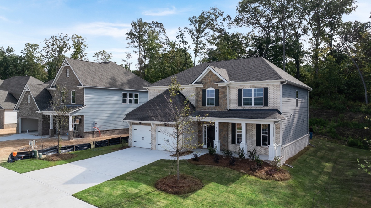 Exterior two-story home with stone detailing
