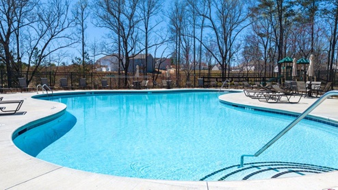 thompson ridge community amenity pool with large pond