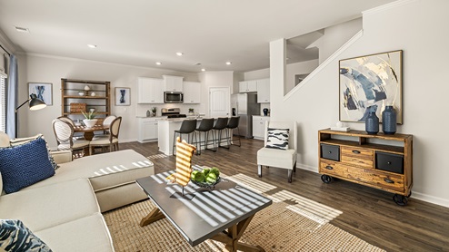 hayden open living room with a floating electric fireplace at thompson ridge in dallas georgia