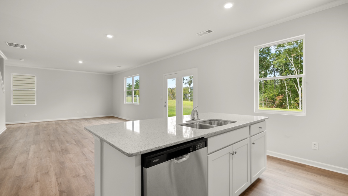 Interior kitchen with center island open to living area