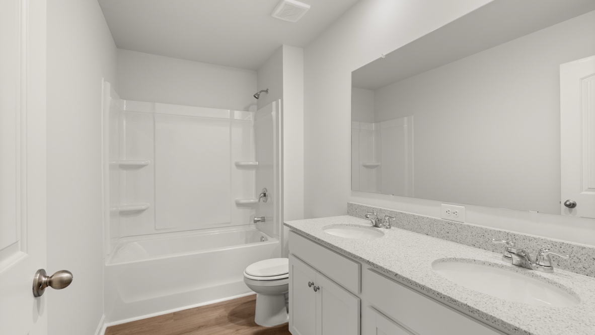 Interior bathroom with bath tub and double sink
