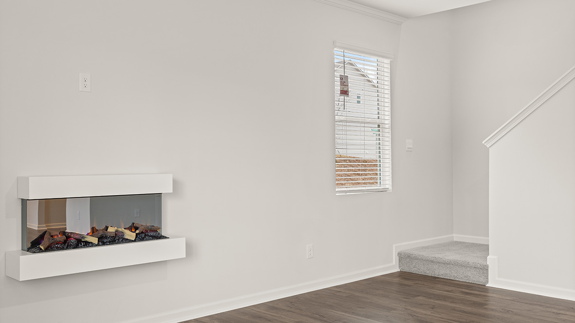 Interior living area with fire place and large windows
