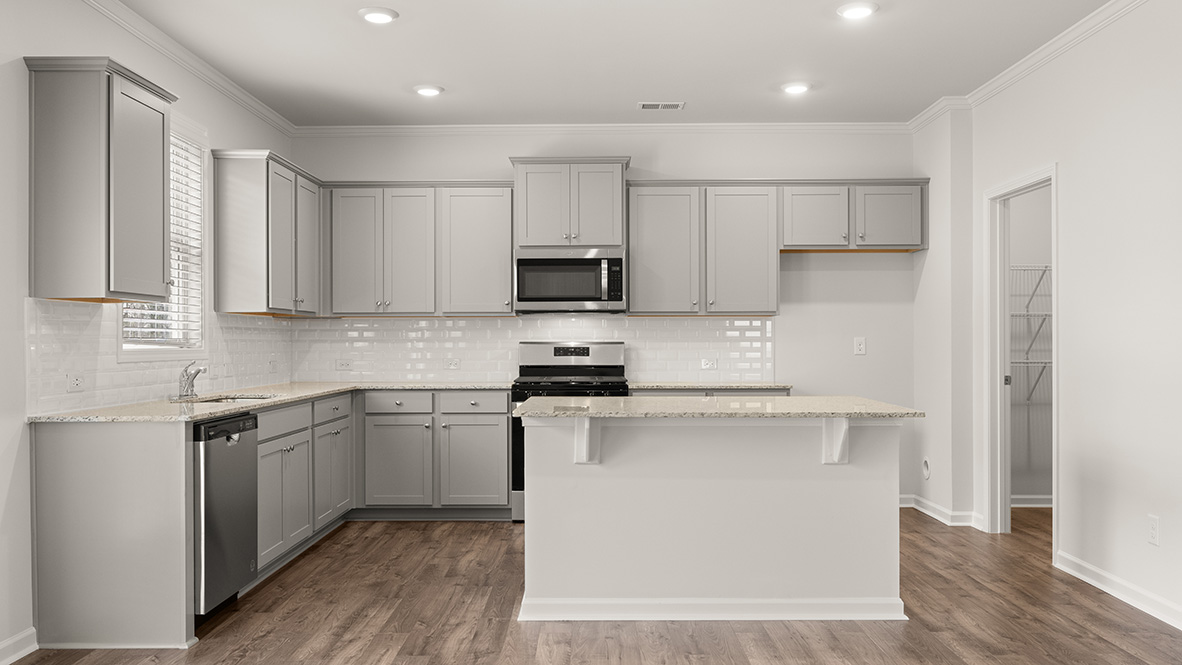 hanover kitchen with grey cabinets and stainless steel appliances at Thompson Ridge