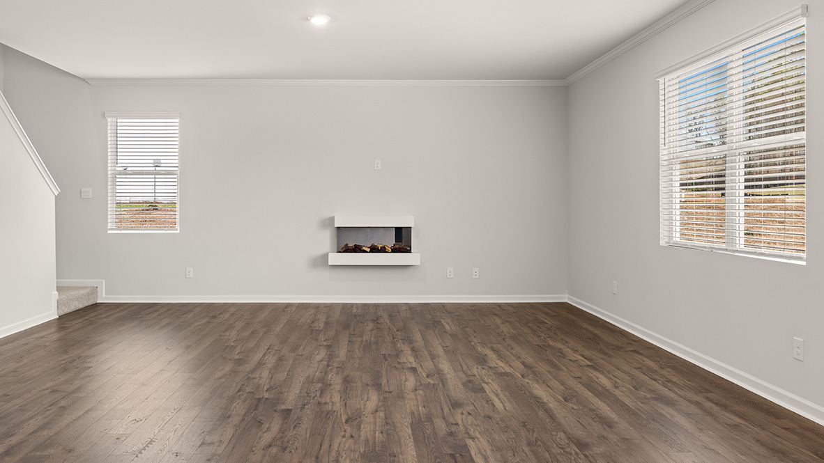 hanover living room with floating electric fireplace at Thompson Ridge