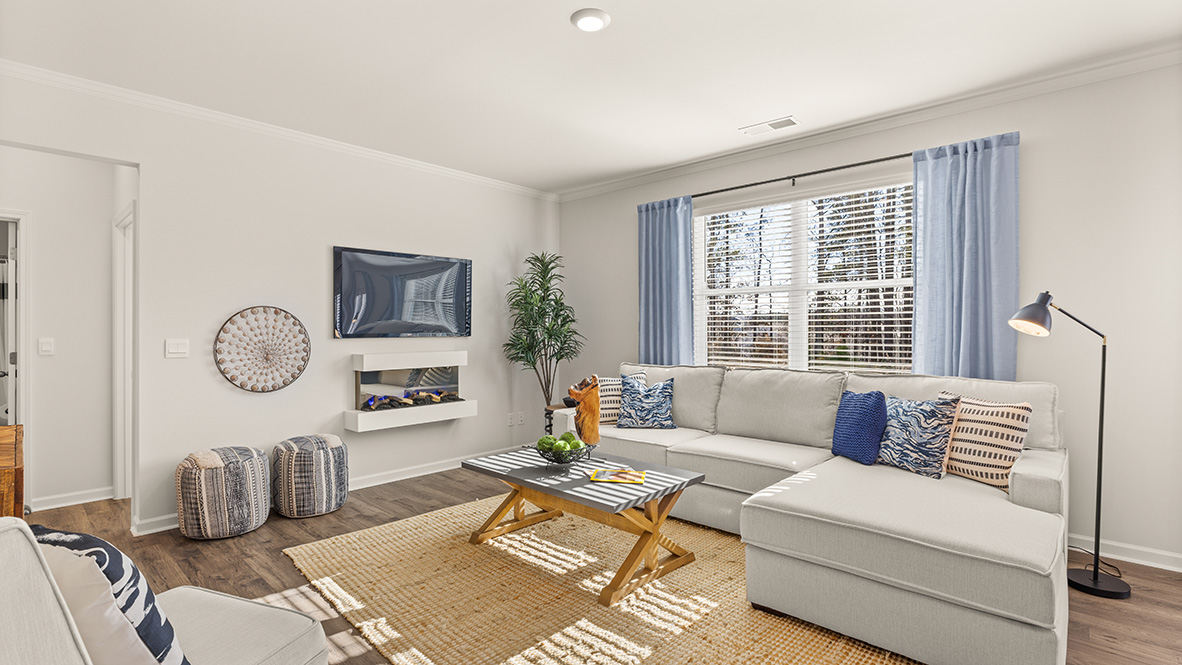 Interior living area with fire place and large window