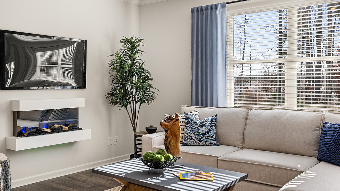 Interior living area with fire place and large window