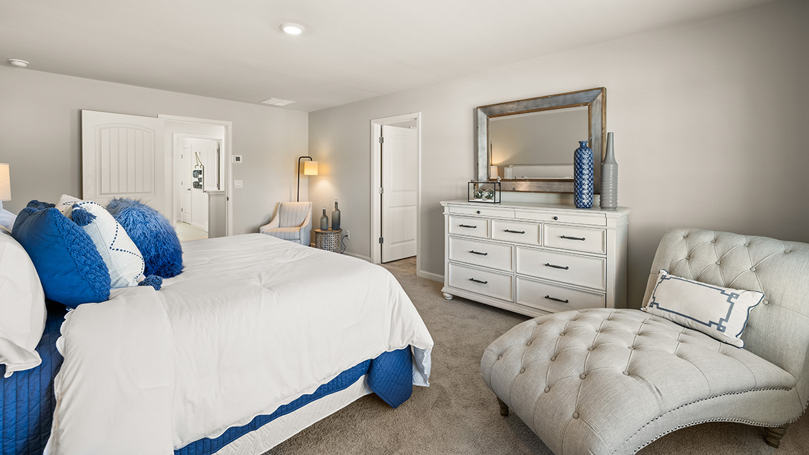 Interior primary bedroom with large window