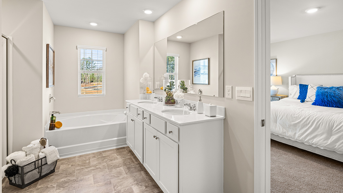 Interior primary bathroom with double sink and shower