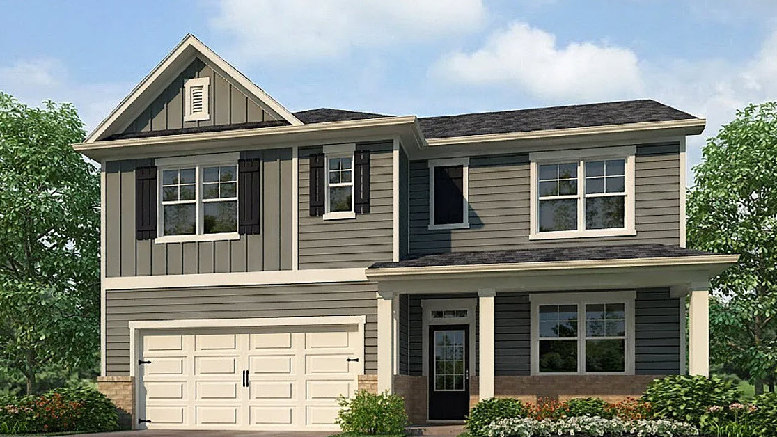 Exterior two-story home with cladding and stone detailing