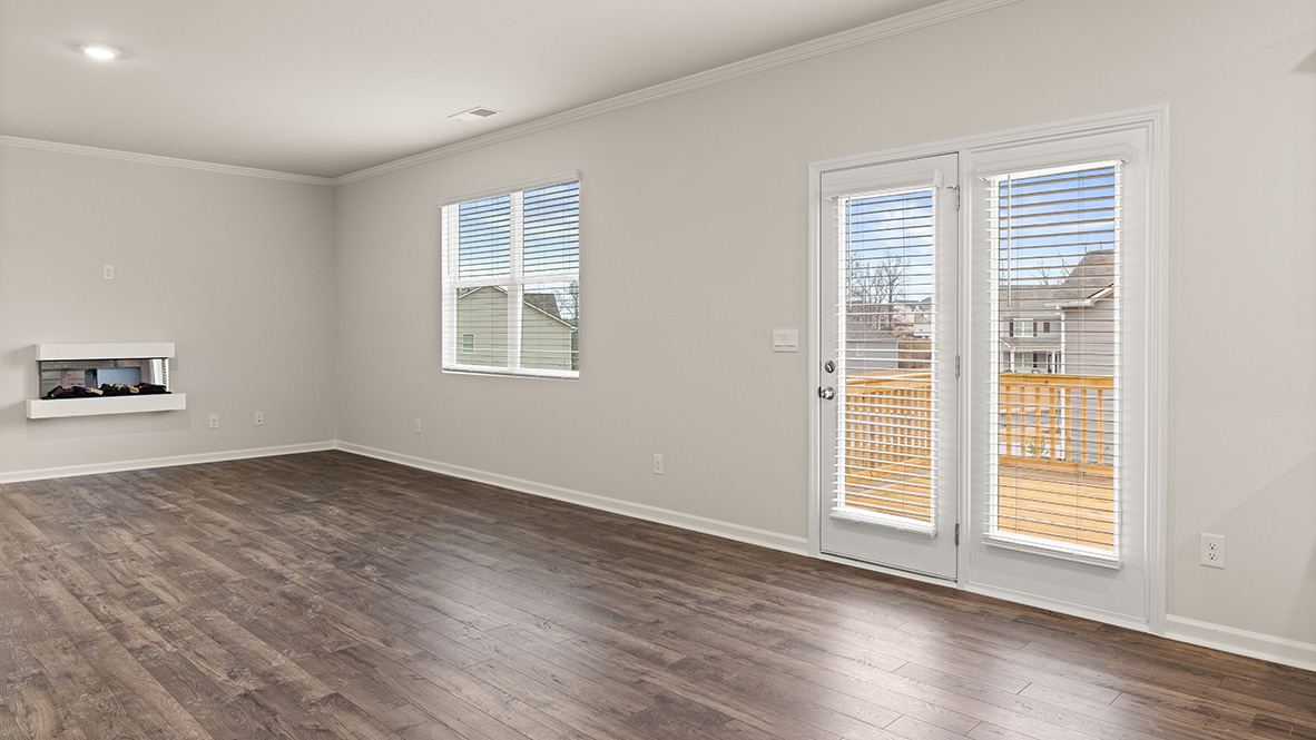 open concept living room with access to the back deck