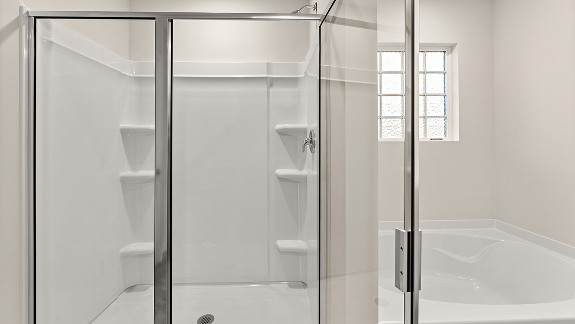 primary bathroom with separate walk in shower