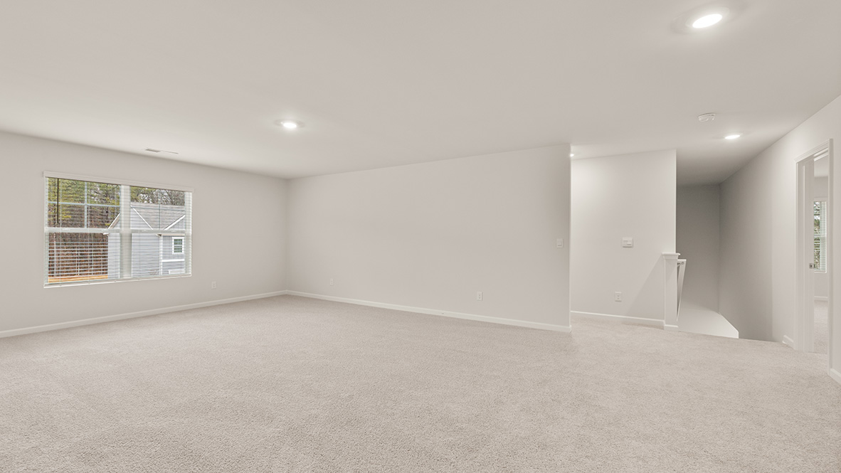 mansfield open loft area with multiple windows at thompson ridge in dallas georgia