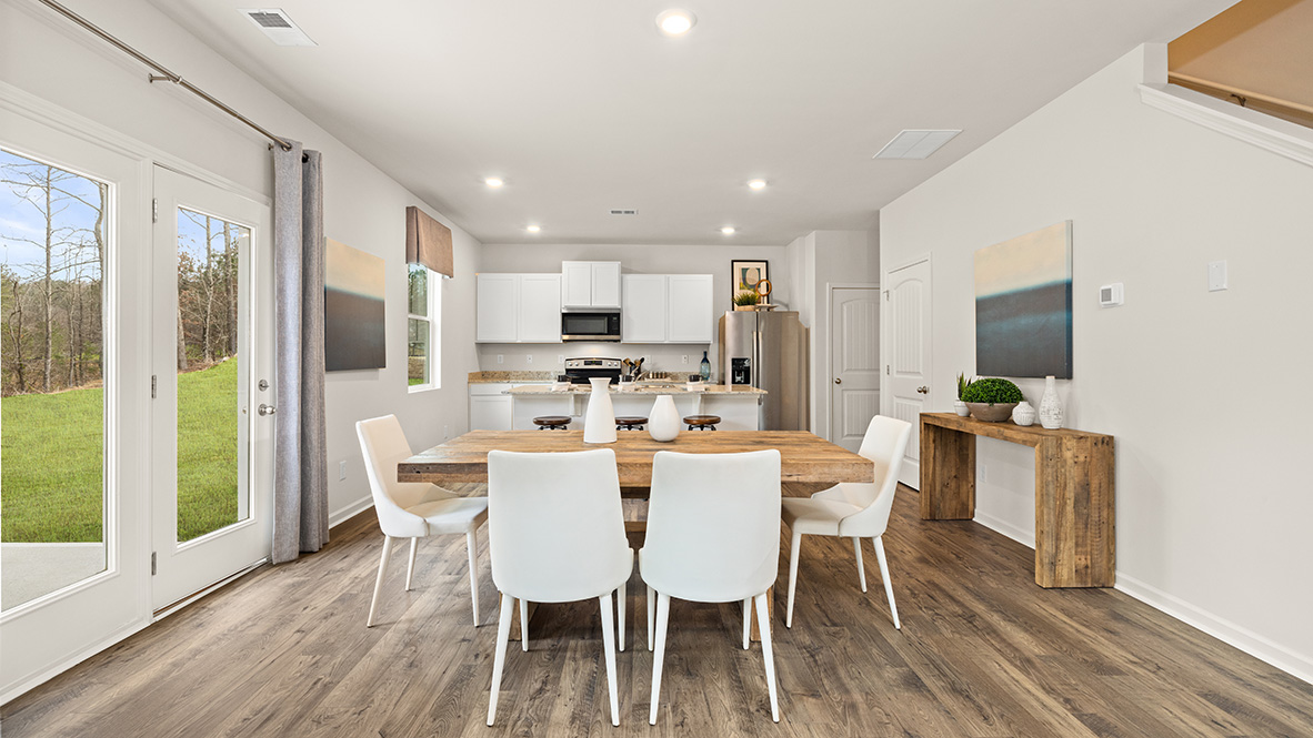 Interior dining area open to kitchen with center island