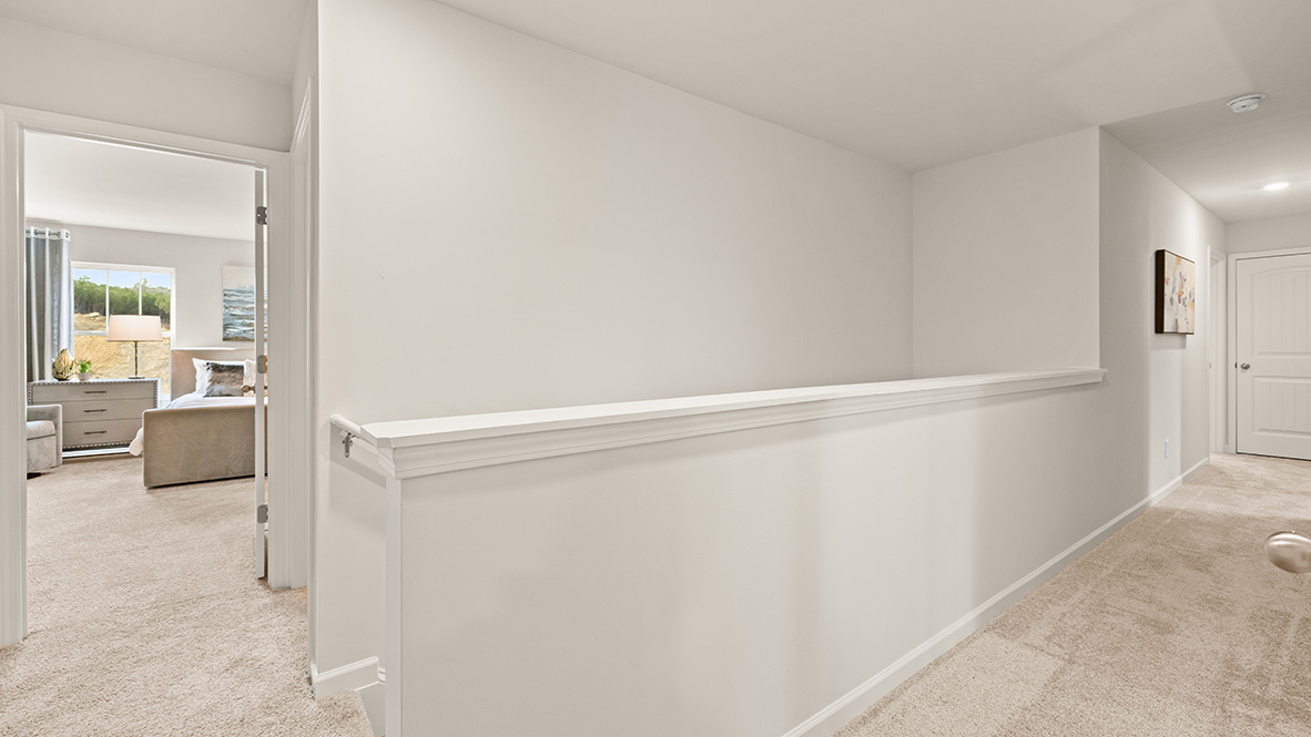 Interior upstairs loft area open to staircase