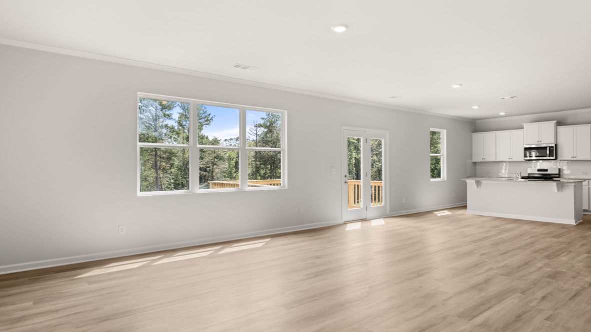 Interior living area with windows and open to kitchen
