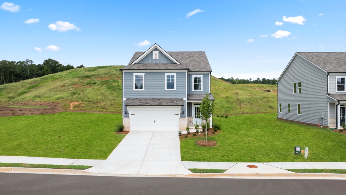 Exterior two-story home with stone detailing
