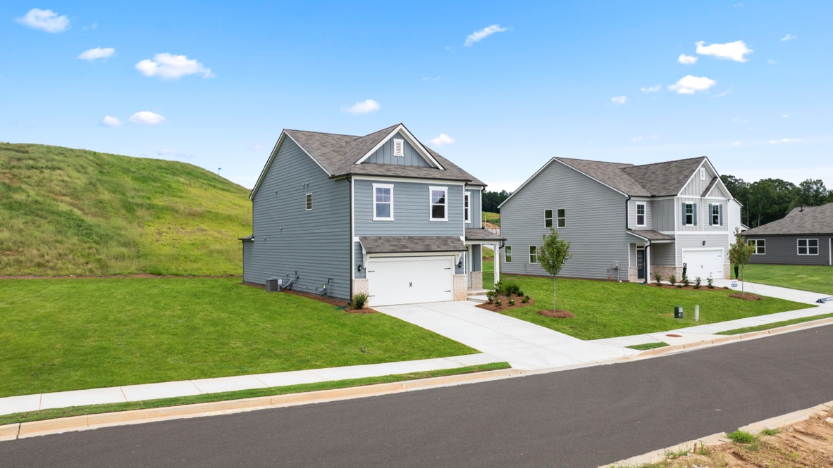 Exterior two-story homes with stone detailing