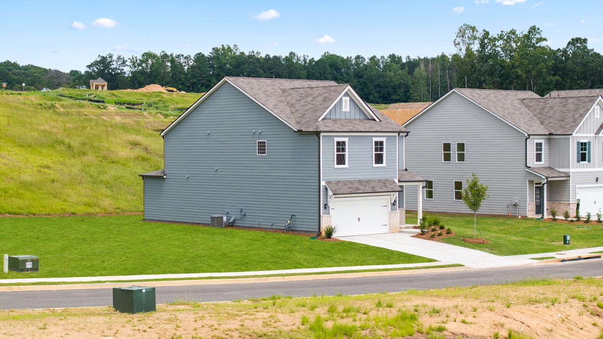 Exterior two-story homes with stone detailing