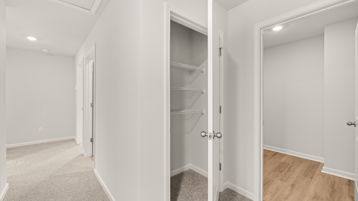 Interior upstairs hallway with hall closet