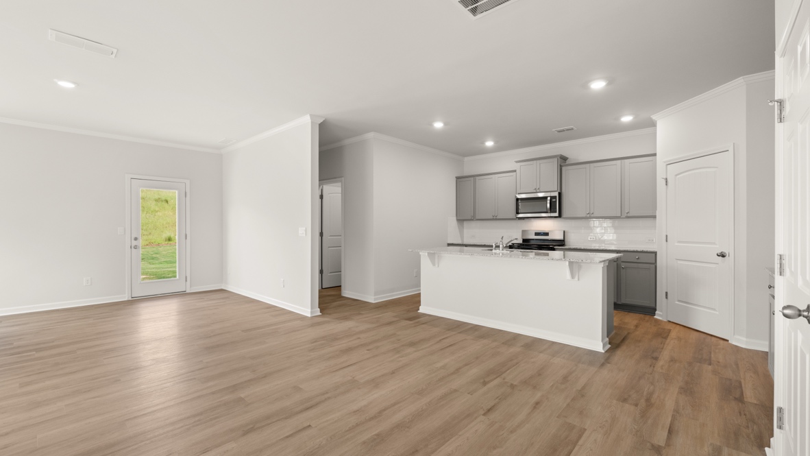 Interior living area open to kitchen with center island