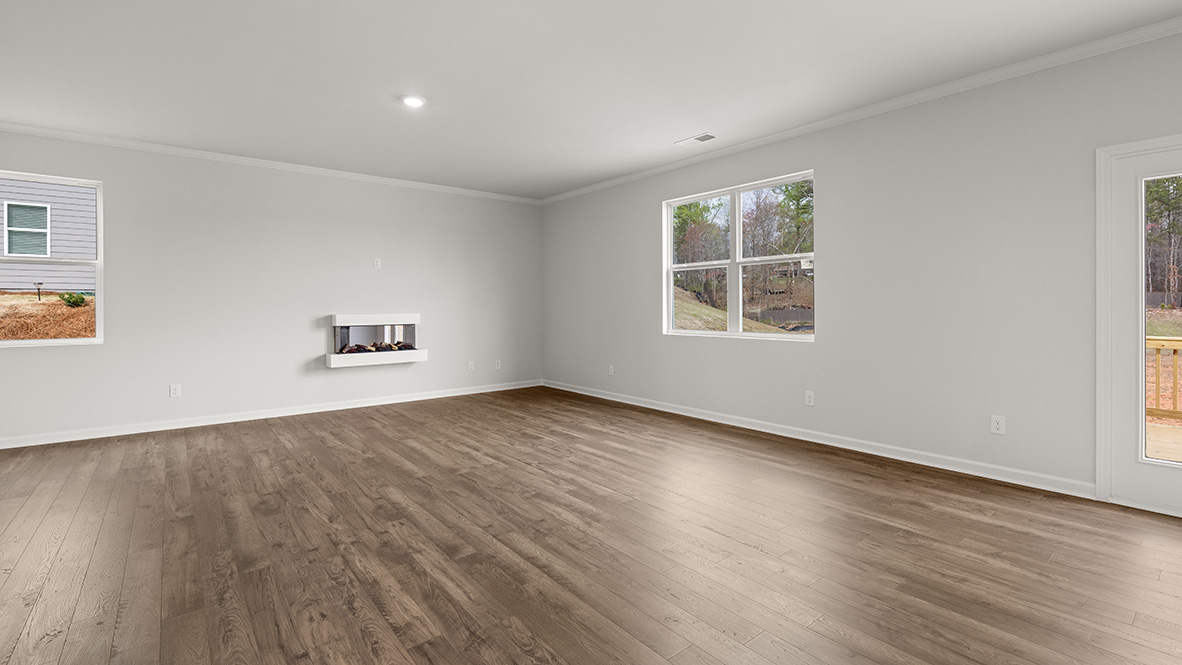 Interior living area with fire place and large windows