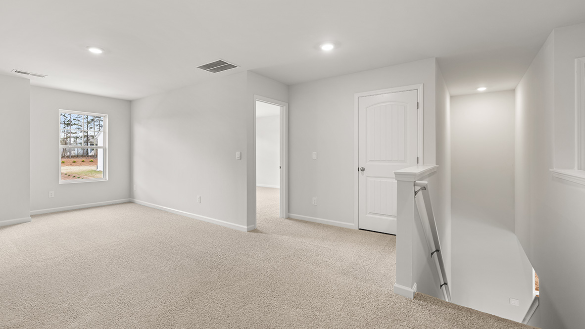 Interior upstairs loft area open to staircase