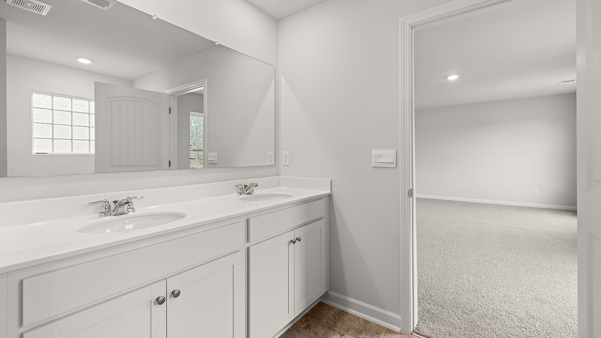Interior primary bathroom with double sink