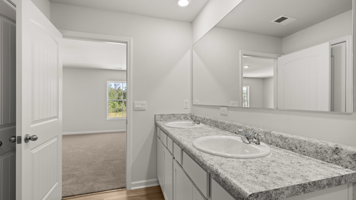 Interior primary bathroom with double sink