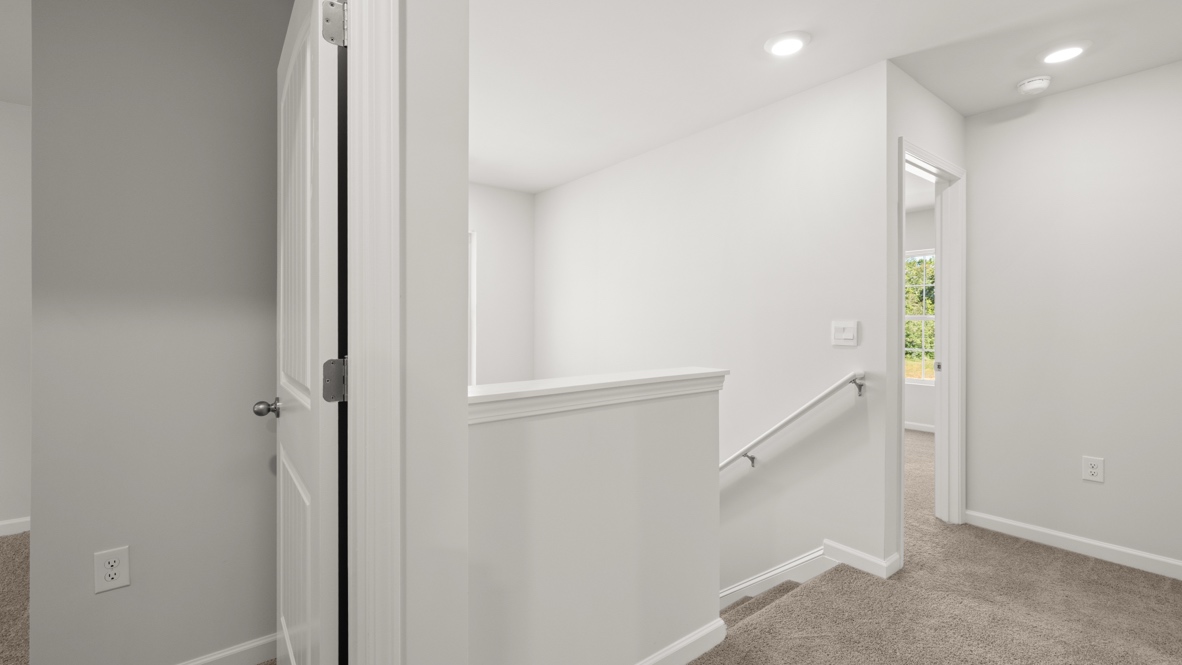 Interior upstairs loft area open to staircase