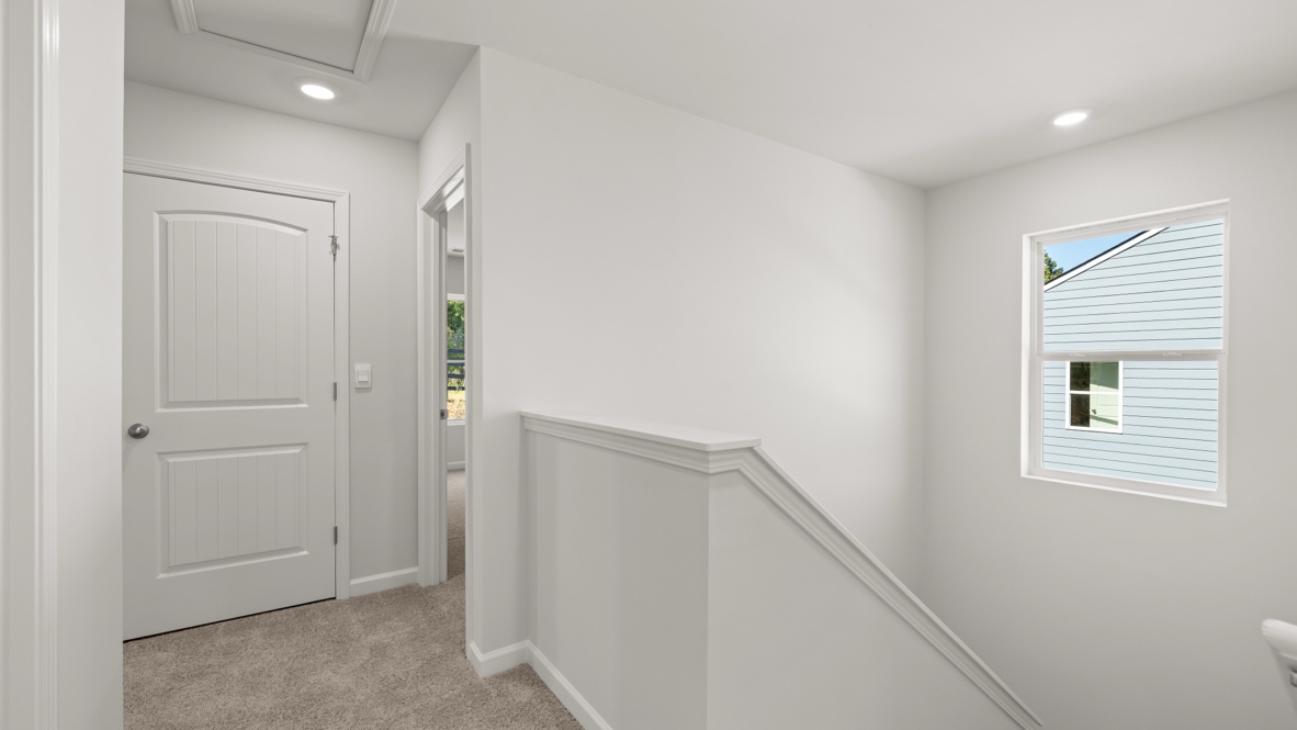 Interior upstairs loft area open to staircase